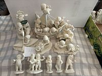 Full lot overview showing all Snowbabies figurines