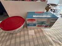 Boxed 24-piece Rubbermaid Easy Find Lids set beside nested containers with red lid