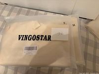 Sealed Vingostar bodysuits in clear bags