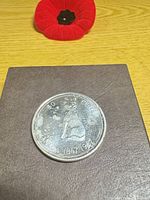 Reverse showing Canadian Coat of Arms centennial design and dates 1867-1967