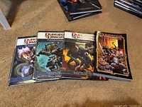 All four D&D 4e books laid out face up