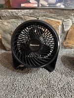 Front view showing Honeywell logo, spiral grill and blades