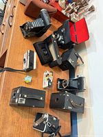Group of vintage cameras on table