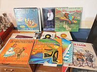 Group shot of all records in lot showing variety of titles and formats