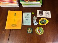 Overhead view of all eight Boy Scout items laid out on table