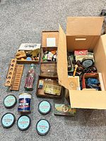 Lot overview showing pipes, racks, tins, accessories and open box