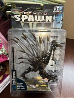 Front view of sealed Techno Spawn Iron Express figure on card