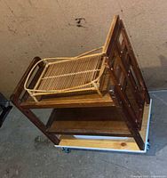 Cart on side showing two shelves, dolly platform and casters