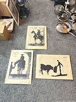 Overview of three Pablo Picasso Toros y Toreros prints on floor
