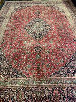 Full view of rug showing pattern and wear