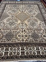 Full view of the Baluchi rug showing overall design and borders