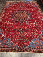 Full view of Mashhad rug showing overall pattern and dimensions