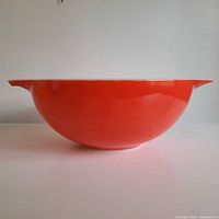 side profile of red Pyrex Cinderella mixing bowl
