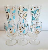 Front view of all six glasses showing pattern and forms