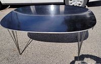 Overall view of Fritz Hansen elliptical table top and legs
