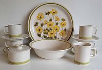 Overall view of Fuji Stone Springtime dinnerware set: platter, bowl, sugar, creamer, four cups and saucers