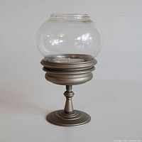 assembled pewter holder with glass globe