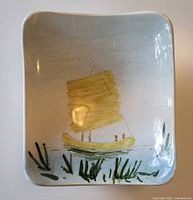 Top view showing sailboat and reeds painting