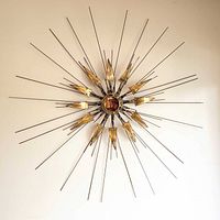 Full view of starburst sculpture on wall