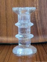 side view of clear textured glass candlestick holder