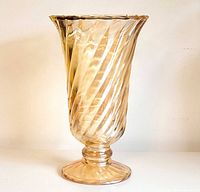 side view of peach luster pressed glass vase