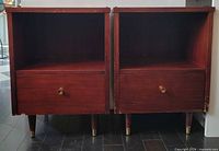 Front view of both Pepplers nightstands showing open shelves, drawers, legs