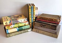 Full view of two stacks of vintage hardcover children’s books