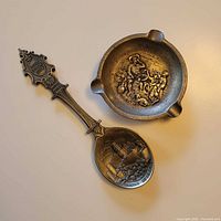 Ashtray and spoon together showing size relation and designs