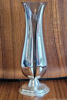 Full side view of silver-plated tulip bud vase