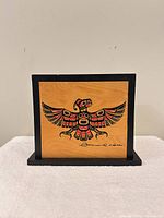 Front view showing Thunderbird design and artist signature