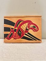 Front view of wooden box showing salmon image