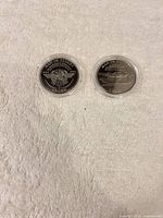 Both Man in Flight 1 Crown coins in capsules