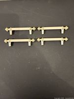 all four handles laid out showing design and finish