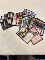 Spread of assorted Magic cards fan-arranged on tabletop