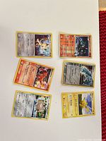 All six Pokémon cards laid out on table