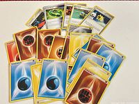 Spread of energy cards showing Fighting, Water, Lightning, Colorless varieties