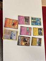 All eight cards laid out on white surface