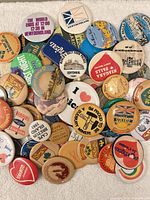 Pile of multicoloured souvenir and slogan pin-back buttons