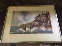 Framed original watercolour painting of Ballantine's Cove with rocky cliffs and ocean, showing full artwork and frame.