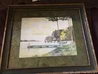 Framed original watercolour painting showing Brockville waterfront with dock, trees and shoreline in soft colors.