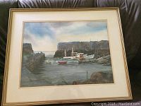 Full view of the watercolor painting matted and framed depicting Lanes Cove harbor with boats and stone piers.