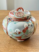 full view of hand painted ceramic ginger jar with lid