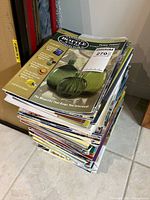 Stack of magazines showing thickness and general condition