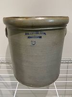Front view showing full crock, handles and rolled rim