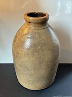 Front view showing maker’s embossing and overall form