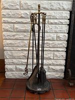 Full view of fireplace tool set on stand