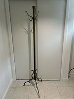 Full view of brass coat rack front