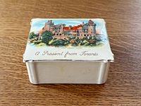 Lid view showing Casa Loma image and text