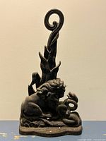 Front view of cast iron doorstop showing full figure