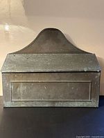 front view of mailbox showing lid and front panel